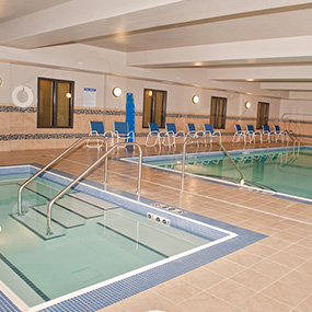 indoor pool & hot tub with a lift enjoy the calming waters at Dickinson
